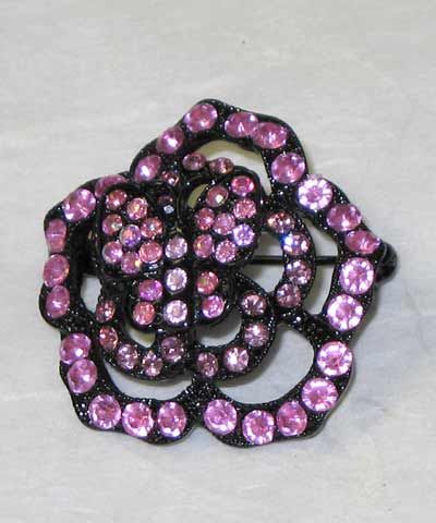 Diamonte brooch in a flower like motif, simple yet stylish. Available in: Pink, Amethyst, Amber, Lim...