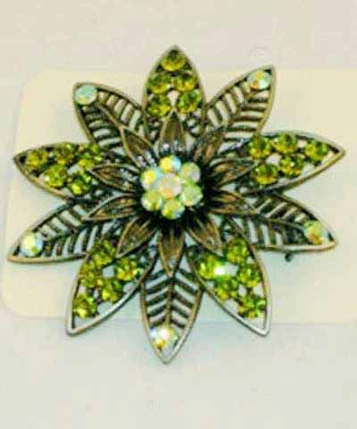 Lonely flower brooch with green stones. Great for jazzing up you outfits....